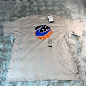 Nike Men’s Beige Tee with Blue and Orange Graphic